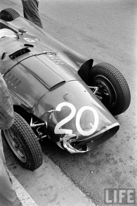 Fangio's damaged D50 in the pits