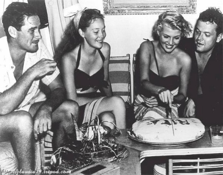 Orson Welles and Rita Hayworth take a break from filming aboard the Zaca